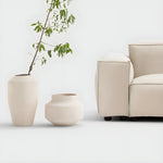 Load image into Gallery viewer, The Damien outdoor couch styled in a Dubai patio, offering premium comfort for outdoor gatherings.