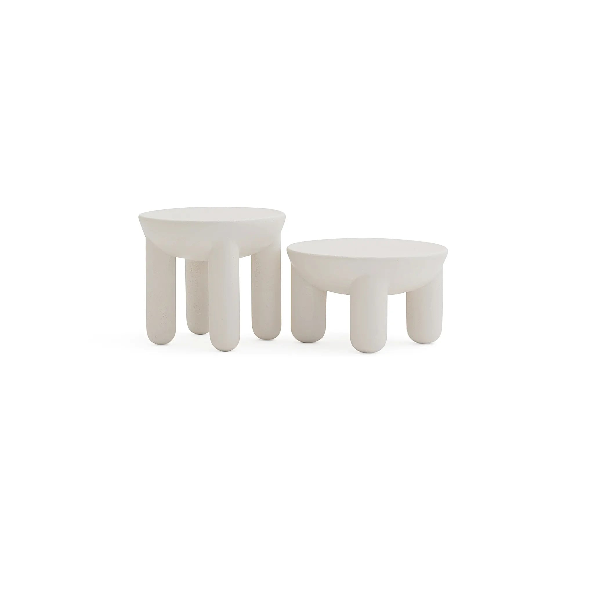 Large circle coffee table in smooth cream finish, modern furniture studio shot