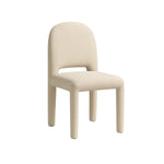 Load image into Gallery viewer, The Shelly fabric dining chair in a neutral grey setting, emphasizing its refined and modern aesthetic.