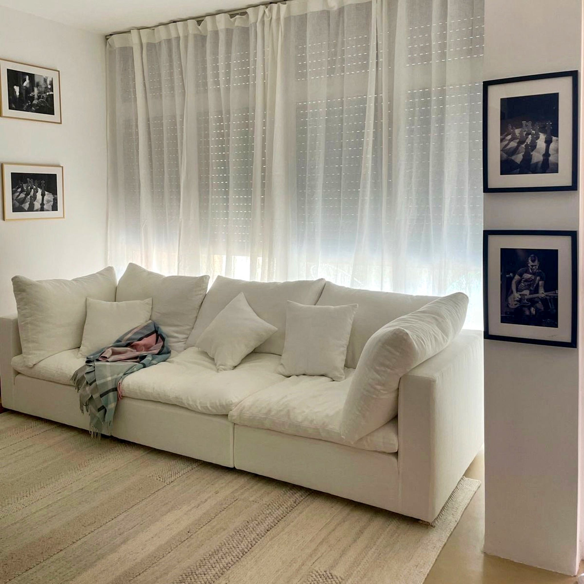 Luxurious Feather Cloud Sofa with 3 sections styled in a contemporary Dubai living room with modern decor.