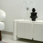 Load image into Gallery viewer, The Dustin corner TV stand, enhancing the aesthetics of cozy apartment living.