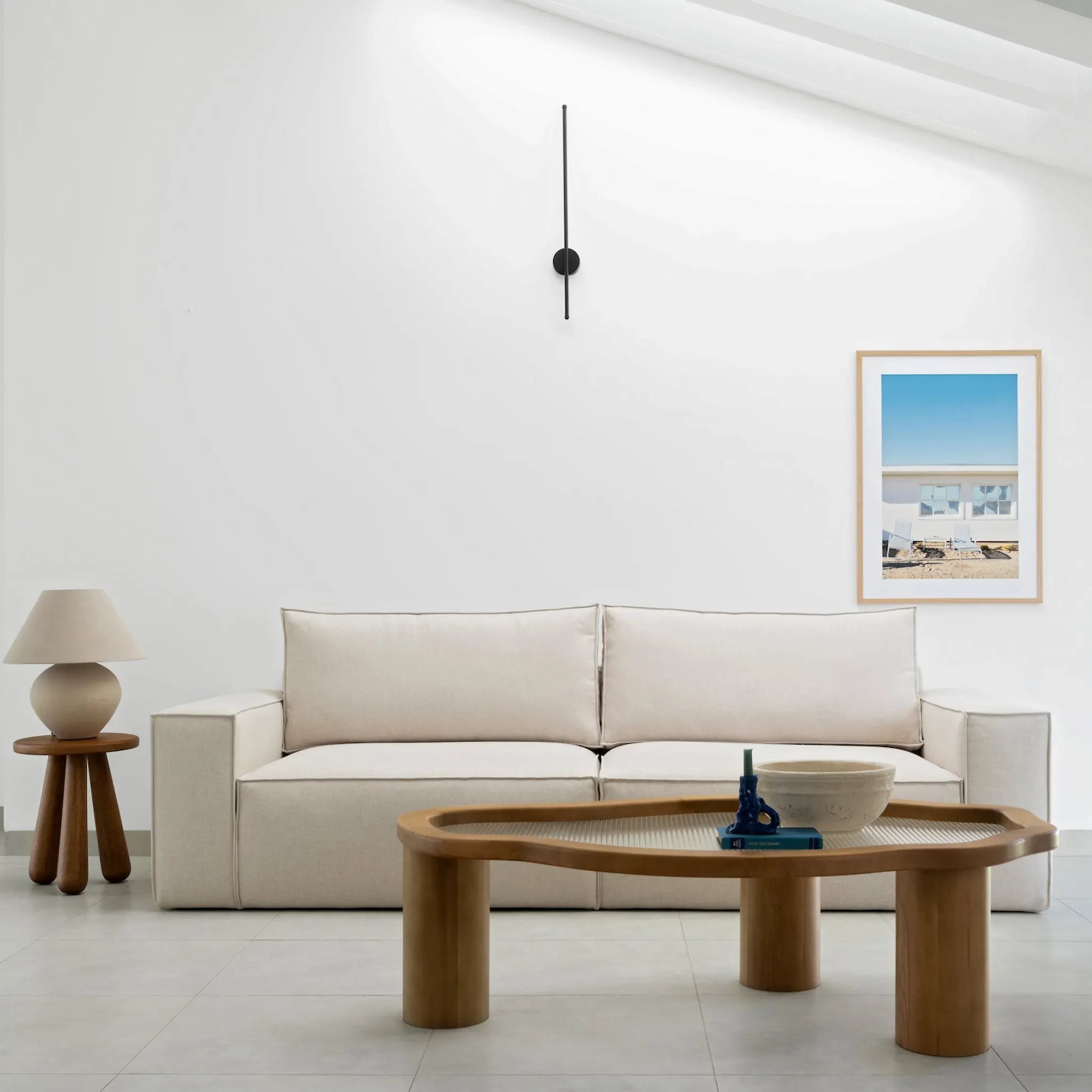 The Gavin Sofa styled in a spacious Dubai villa living room with neutral tones and chic decor.