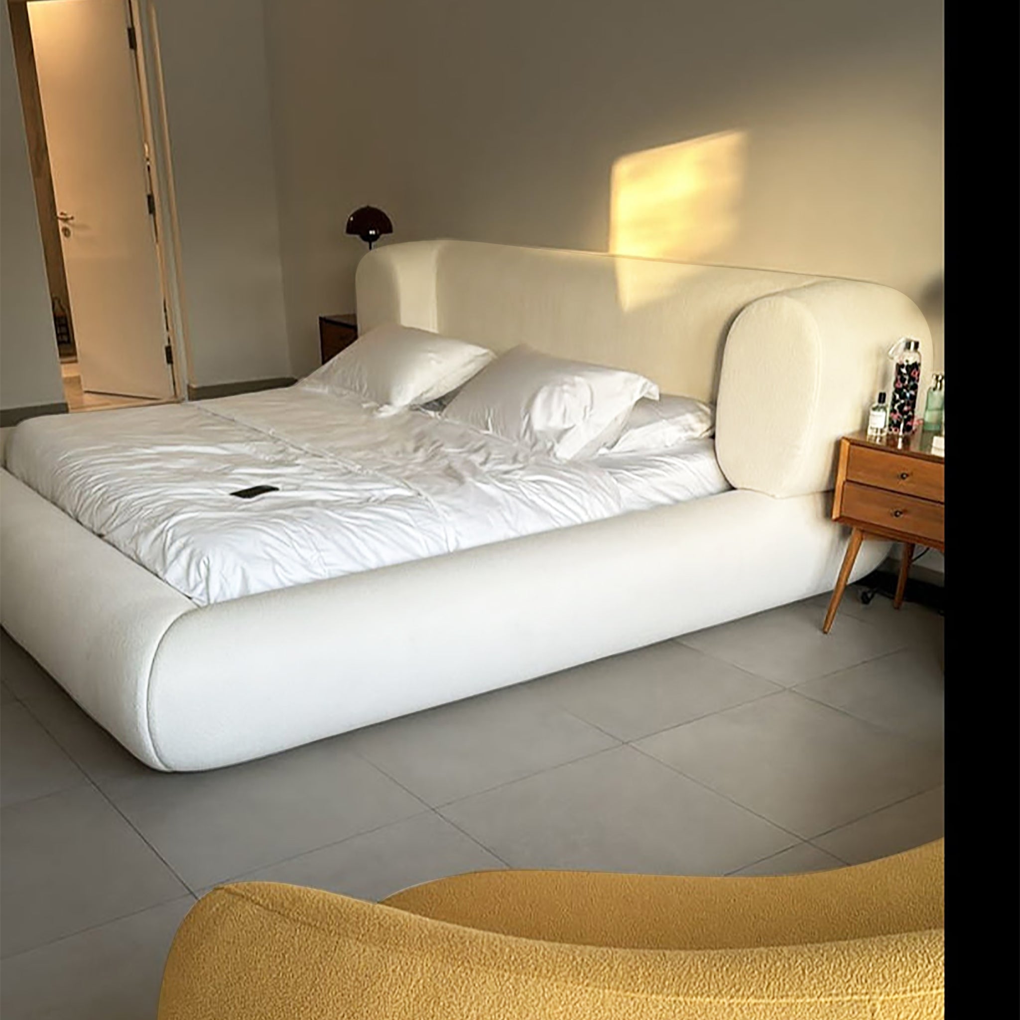 Curved headboard platform bed in a serene bedroom. The Lewis Bed offers plush comfort and a touch of modern luxury. The Lewis luxury bed Life Style view