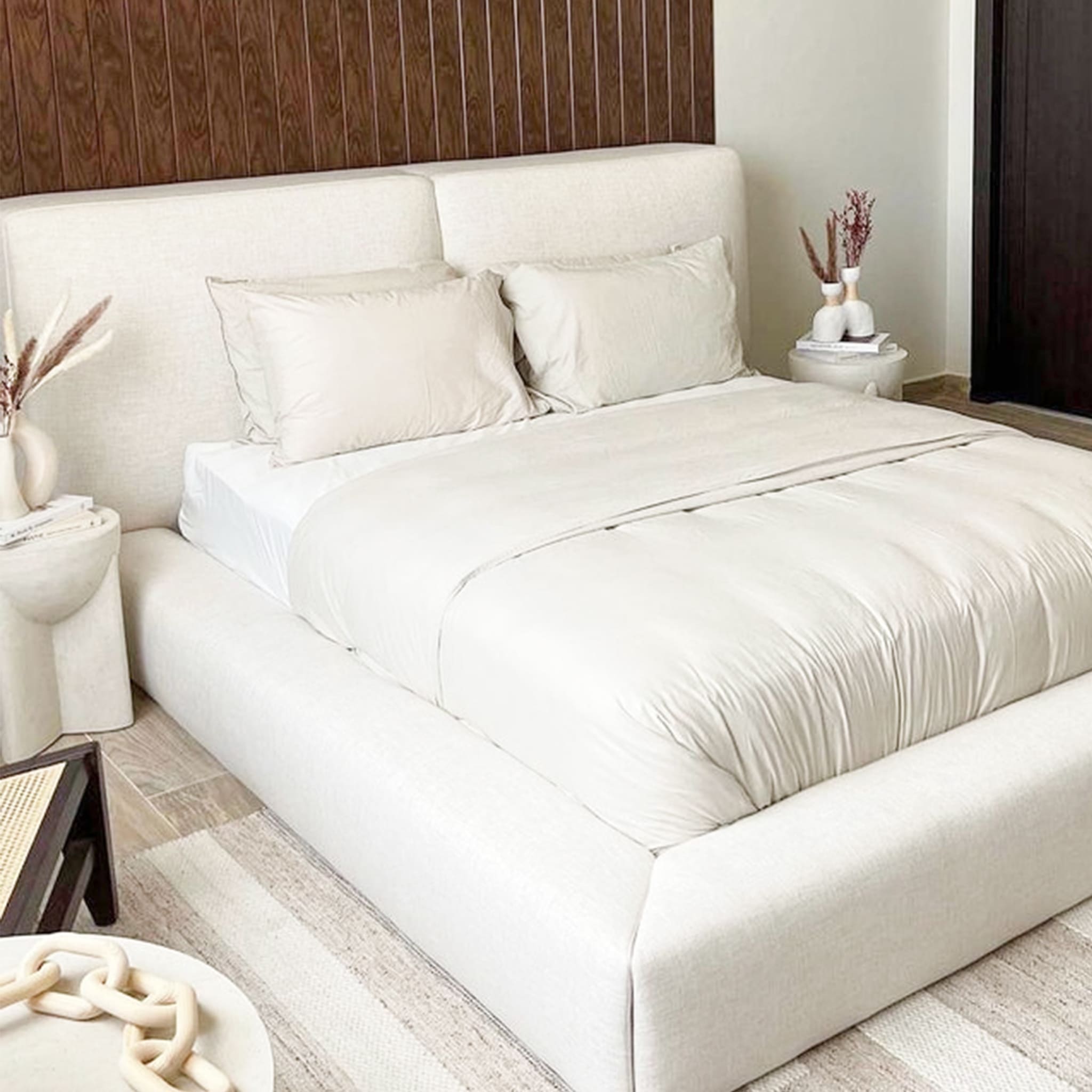 Supportive white platform bed with inviting plush headboard. The Jerry Bed is crafted for cozy mornings and restful sleep. Super king size bed Life Style View.