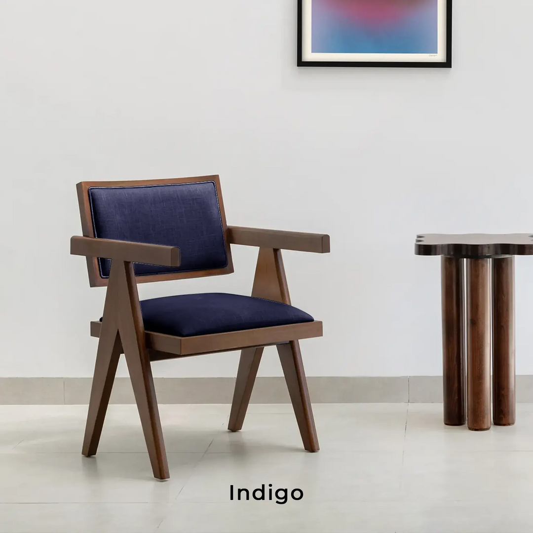 The Pierre wood frame dining chair in a sophisticated dining space, blending classic and modern styles.