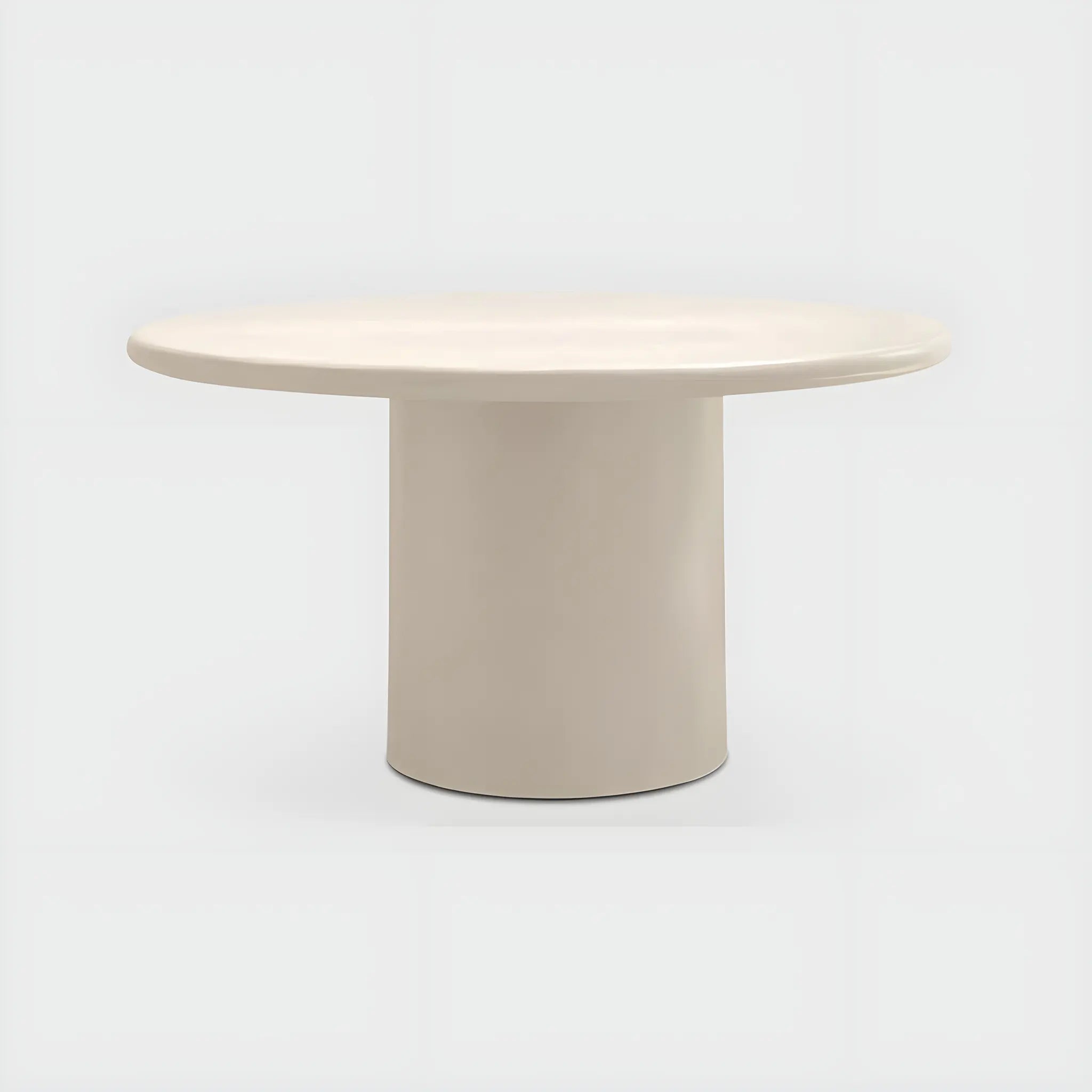 Modern round dining table with a smooth microplaster surface, ideal for elegant dining spaces.