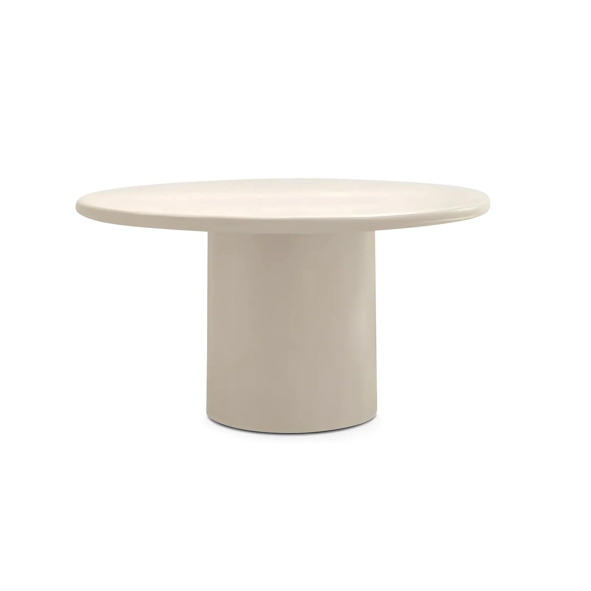 The Marx Microplaster round dining table with a sleek design, perfect for modern interiors.