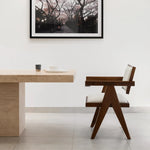 Load image into Gallery viewer, The Pierre wood frame dining chair styled in a bright dining room, bringing elegance and comfort together.