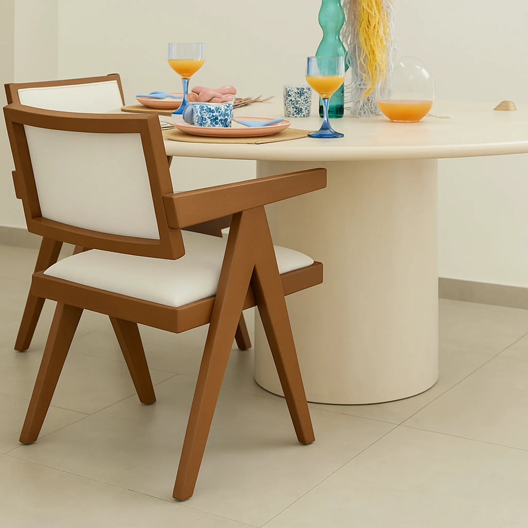 Modern wood frame dining chair, positioned around a minimalist dining table to create a warm atmosphere.