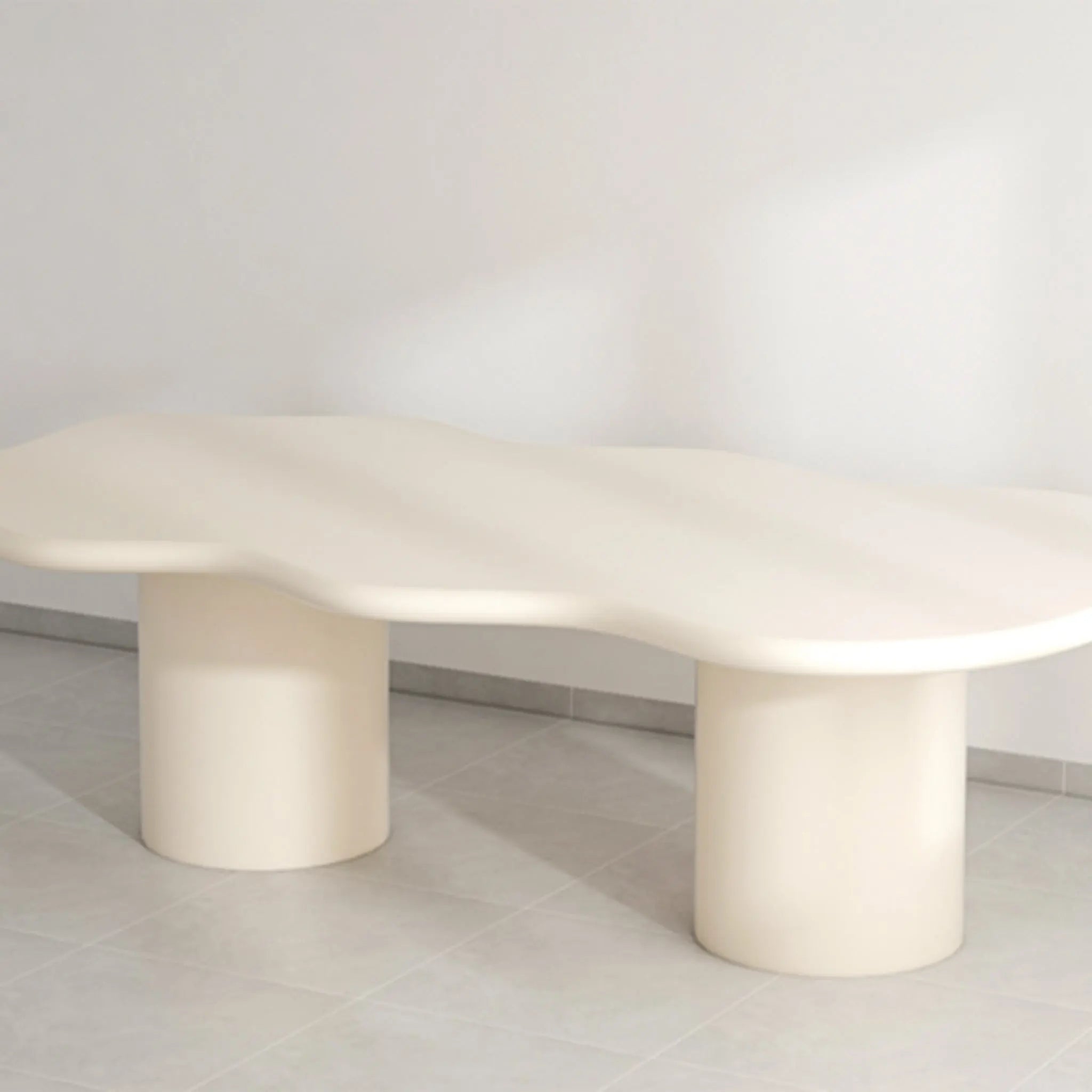 The Victoria microplaster dining table styled with elegant chairs, perfect for modern homes.