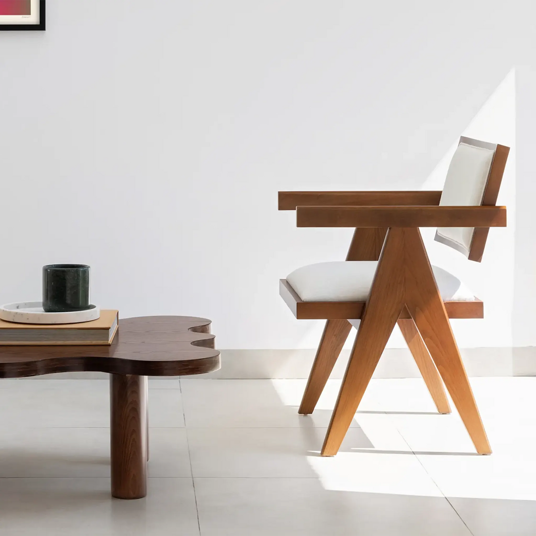 The Pierre wood frame dining chair, offering an elegant seating solution for both family meals and entertaining guests.