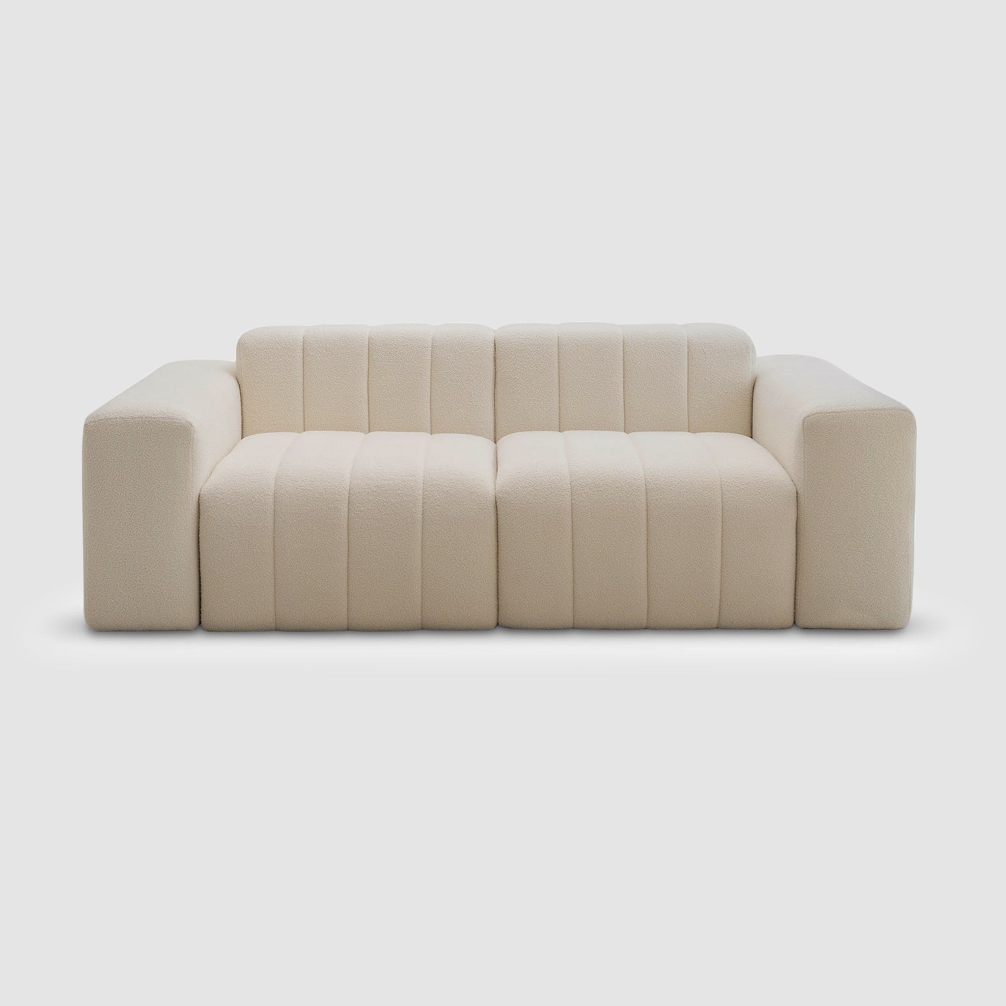 White modern couch on a white background. This could be the Klein Sofa by Klettkic.