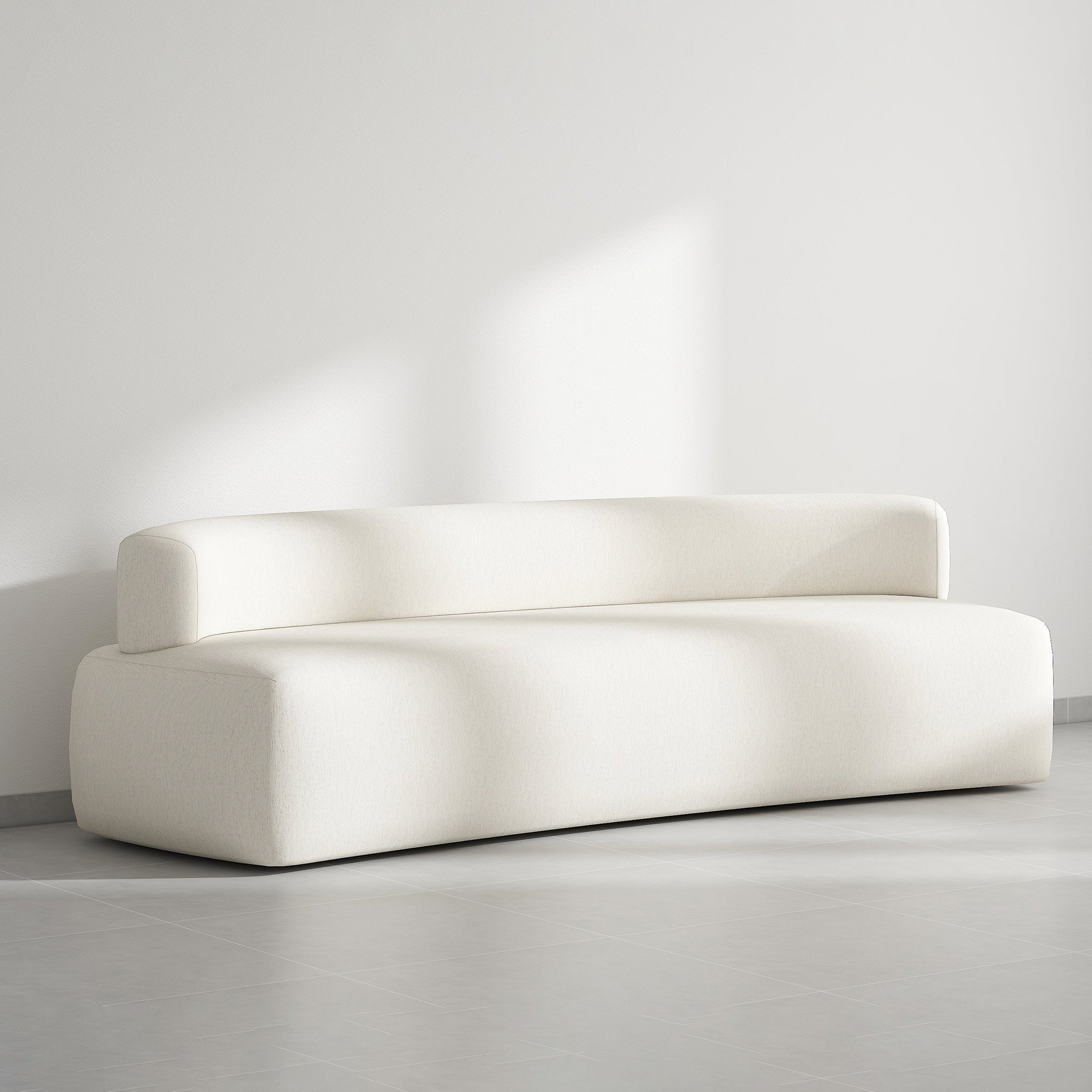 Contemporary white couch with a smooth, curved backrest