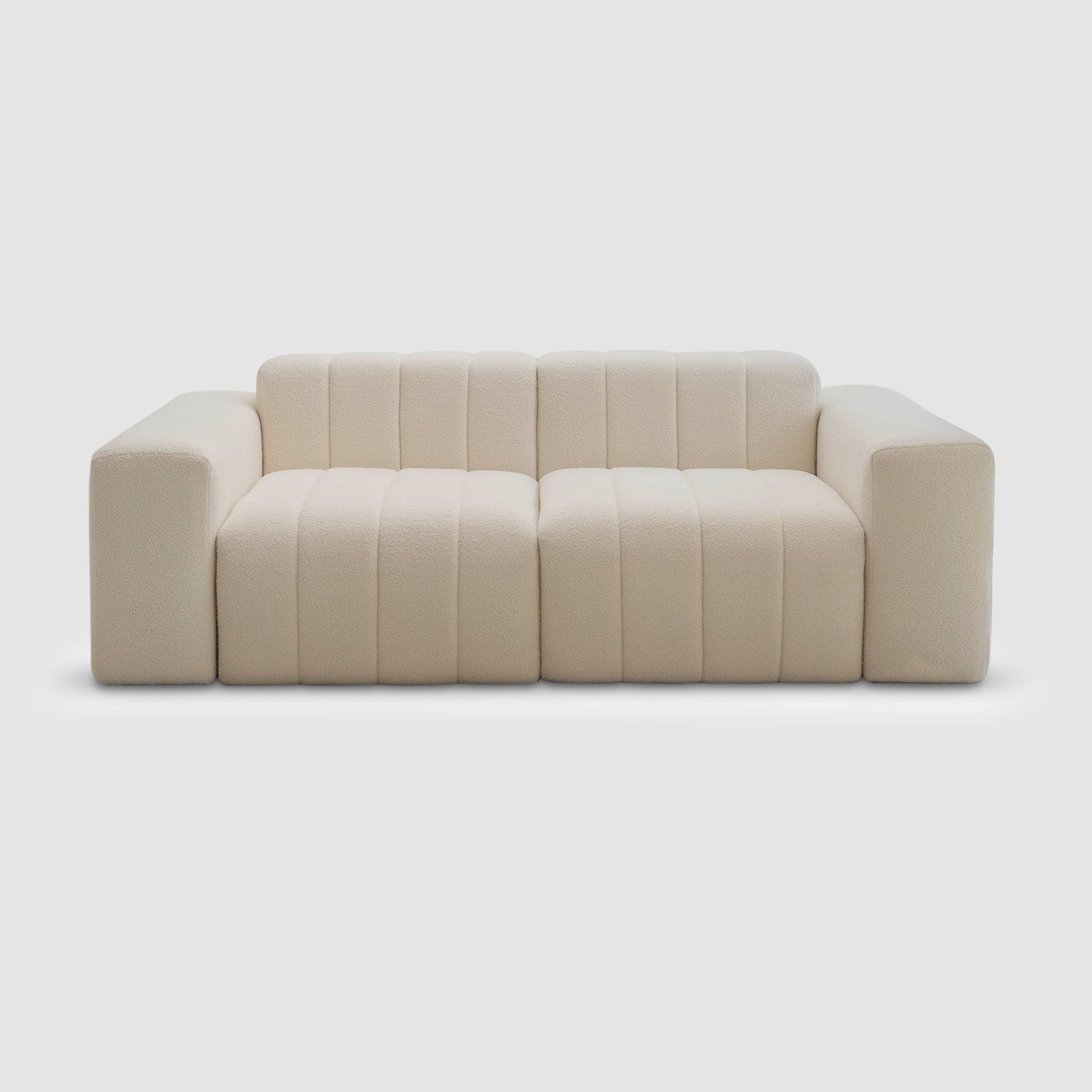 White modern couch on a white background. This could be the Klein Sofa by Klettkic. 4 Seater Sofa 