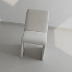 Load image into Gallery viewer, The Carl two leg chair positioned in a dining space, offering a balance of form and function.
