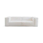 The Damien Modular Couch with a sleek white design on a plain background, perfect for modern homes.