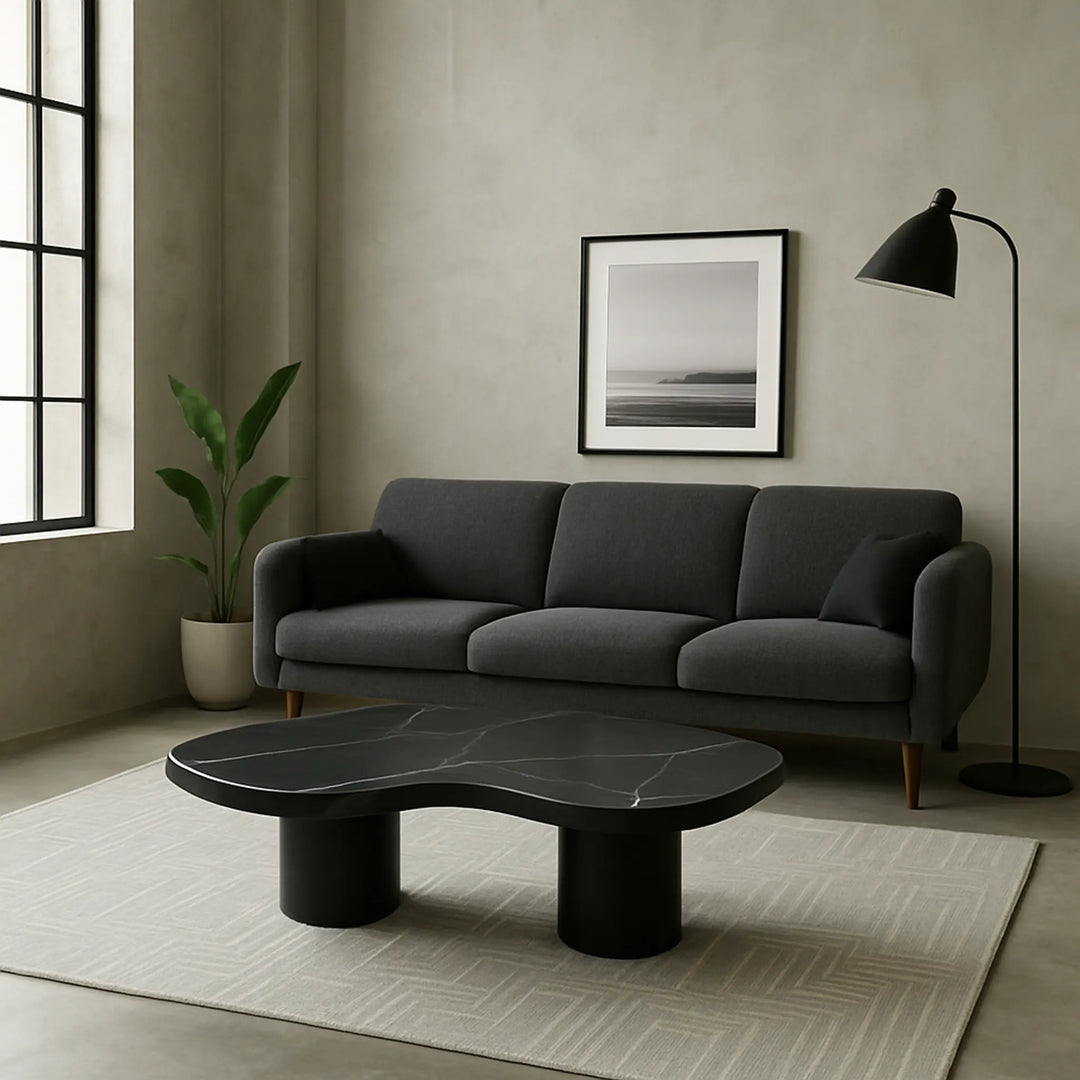 The Eliza Coffee Table styled with candles, vases, and books – a versatile marble top coffee table that blends functionality with fine design.