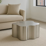 Load image into Gallery viewer, The Genevive Stainless Steel Coffee Table (Medium) complements a contemporary couch, creating a polished living room look.
