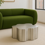 Load image into Gallery viewer, In a stylish living room, this modern steel coffee table serves as a functional and eye-catching centerpiece.
