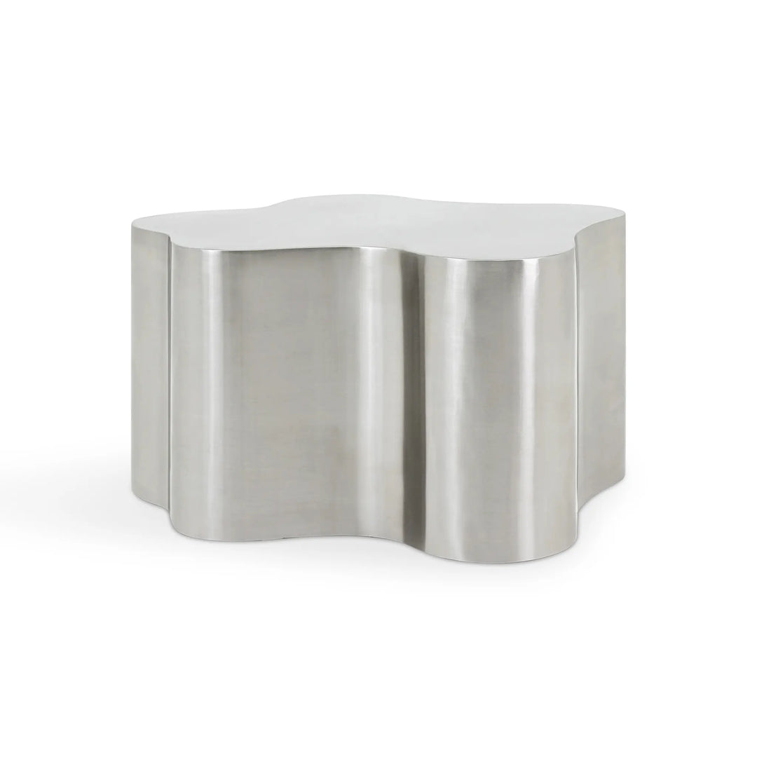 Close-up of the smooth surface of The Genevive Stainless Steel Coffee Table, highlighting its polished steel finish.