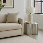 Load image into Gallery viewer, In a bright living room, The Genevive Stainless Steel Coffee Table brings modern sophistication with its reflective surface.
