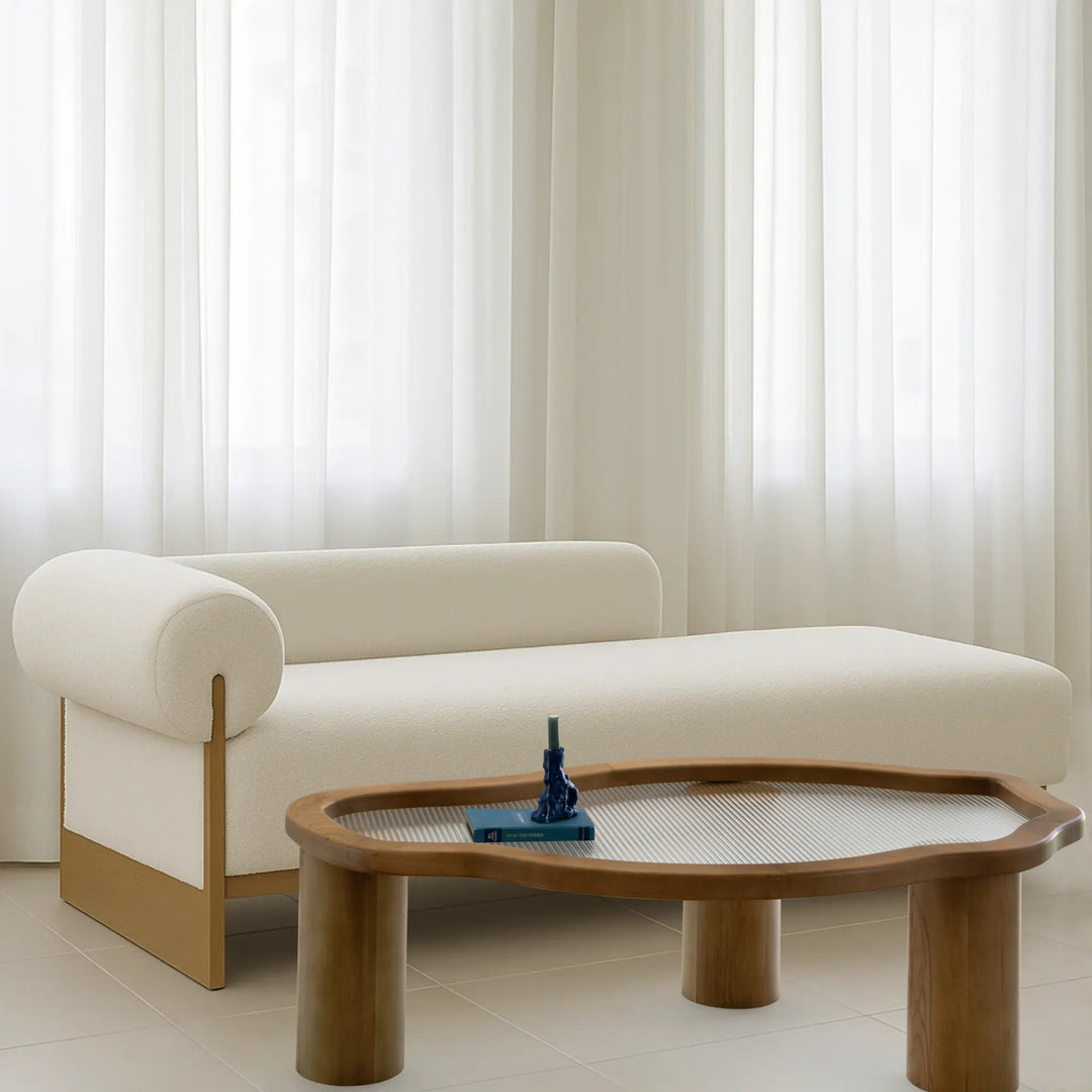 Close-up of The Jamie Coffee Table reveals the intricate wood grain and smooth glass top, highlighting its quality craftsmanship.