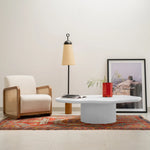 Load image into Gallery viewer, Detail of The Jamie Coffee Table’s micro plaster texture and smooth glass top – a high-end round center table with glass top offering timeless sophistication.
