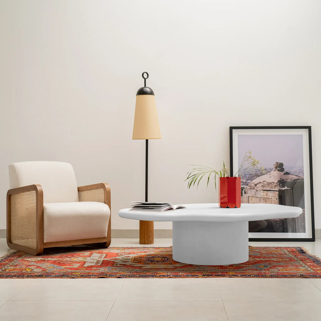 Detail of The Jamie Coffee Table’s micro plaster texture and smooth glass top – a high-end round center table with glass top offering timeless sophistication.