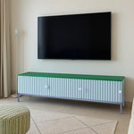 Load image into Gallery viewer, The Rina white TV cabinet with storage, enhancing the decor of a bright, airy living room.
