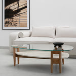 Load image into Gallery viewer, The Scott Coffee Table styled in a cozy living room, showcasing its elegant round glass top and rustic wood base – ideal as a glass top center table for modern homes.&quot;
