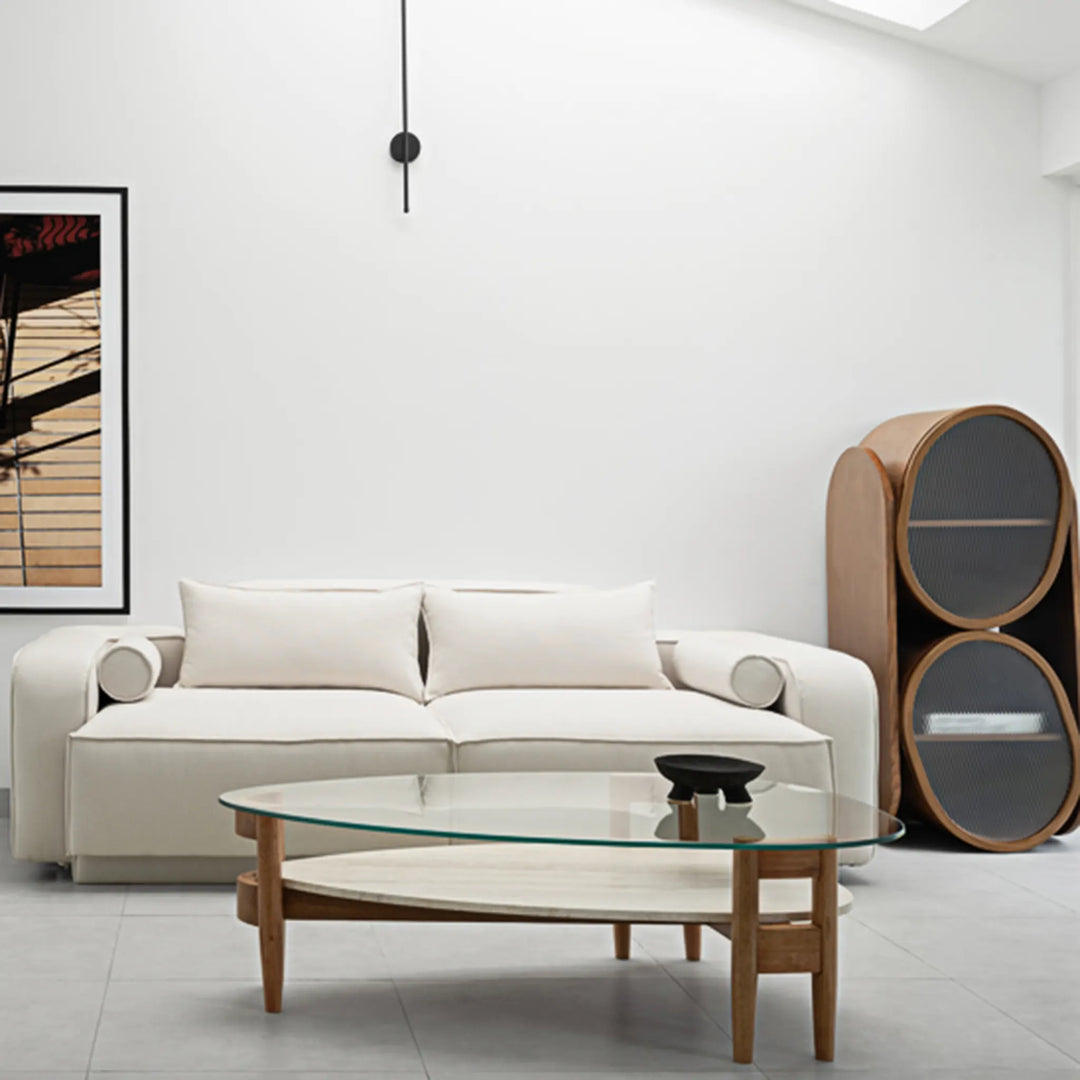 Sleek and simple, The Scott Coffee Table pairs a clear glass top with a minimalist wooden frame – a small round glass coffee table ideal for compact interiors.