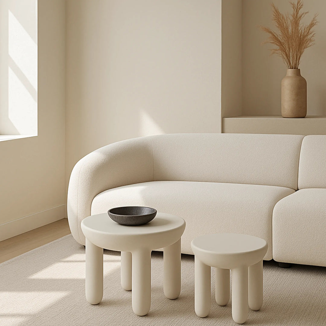 Cream round coffee table in Scandinavian-inspired lounge setup