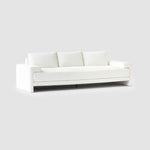 Load image into Gallery viewer, The Sylvia modern white sofa with seamless texture, highlighted on a grey backdrop for contrast.
