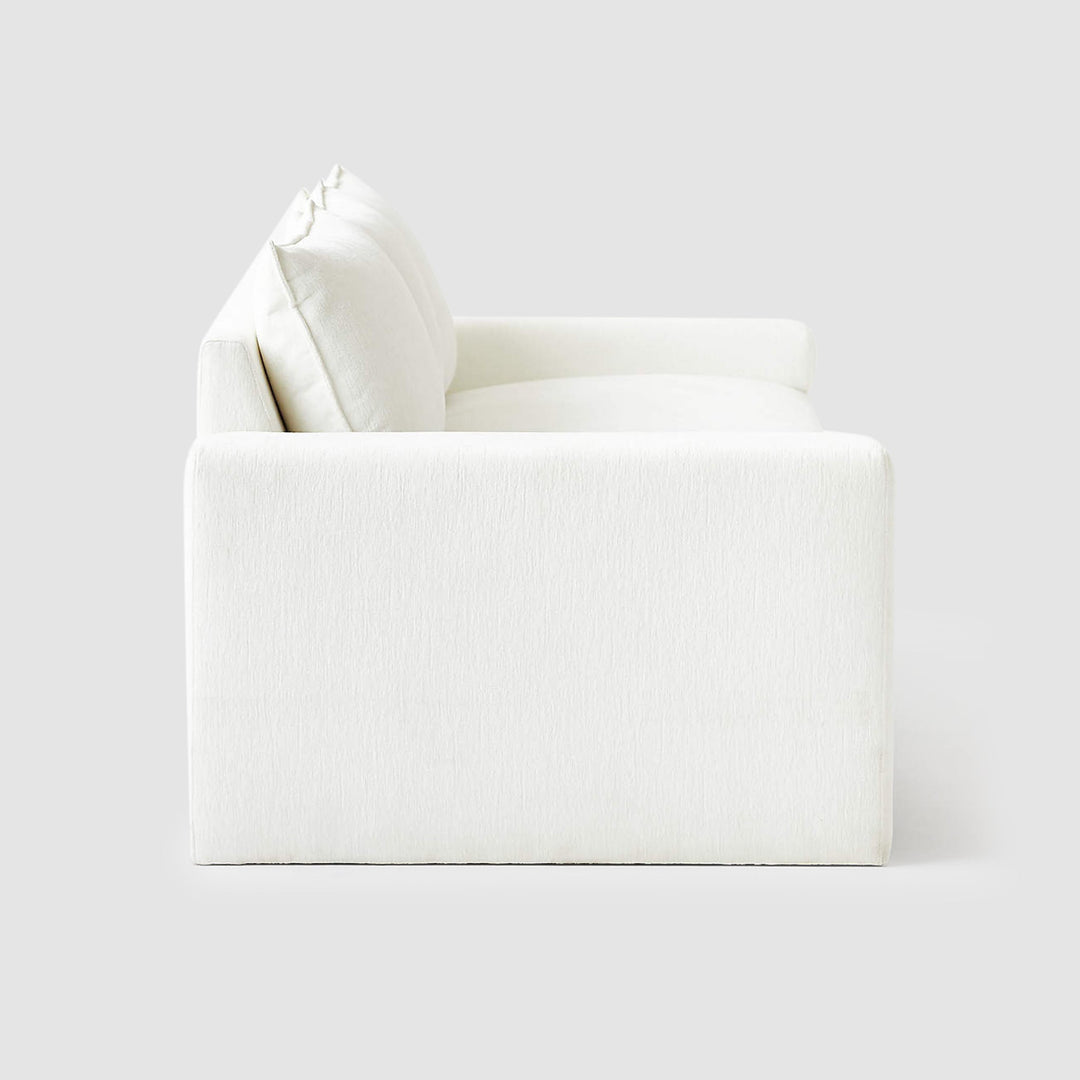Contemporary modern white sofa crafted with smooth, seamless upholstery for modern living.