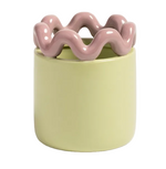 Load image into Gallery viewer, A ceramic planter with a smooth, matte pale yellow-green cylindrical body and a glossy, wavy, wavy-piped rim in a dusty pink color, shown on a light gray background.