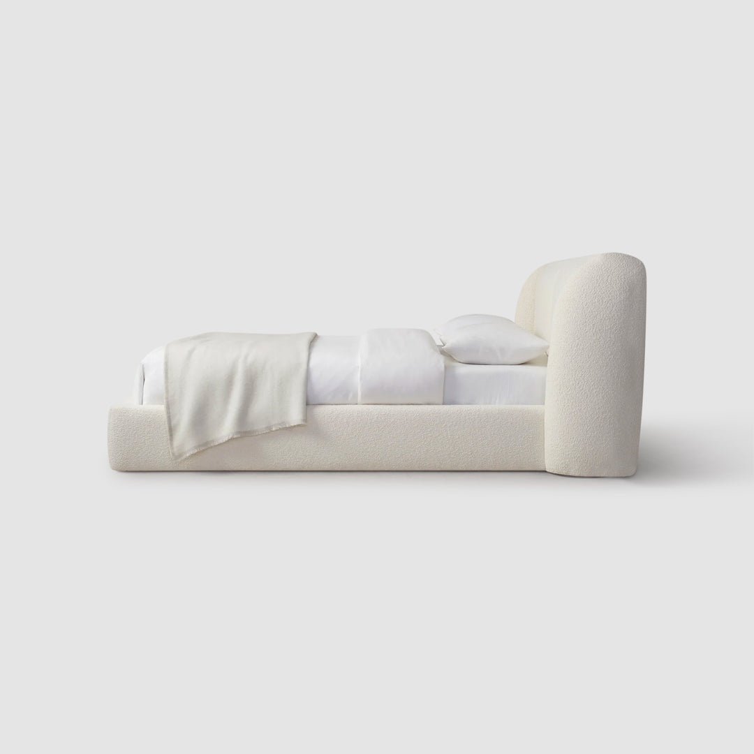 Indulge in relaxation on the Ashley white platform bed with crisp white linens.  Best luxury bedding in dubai