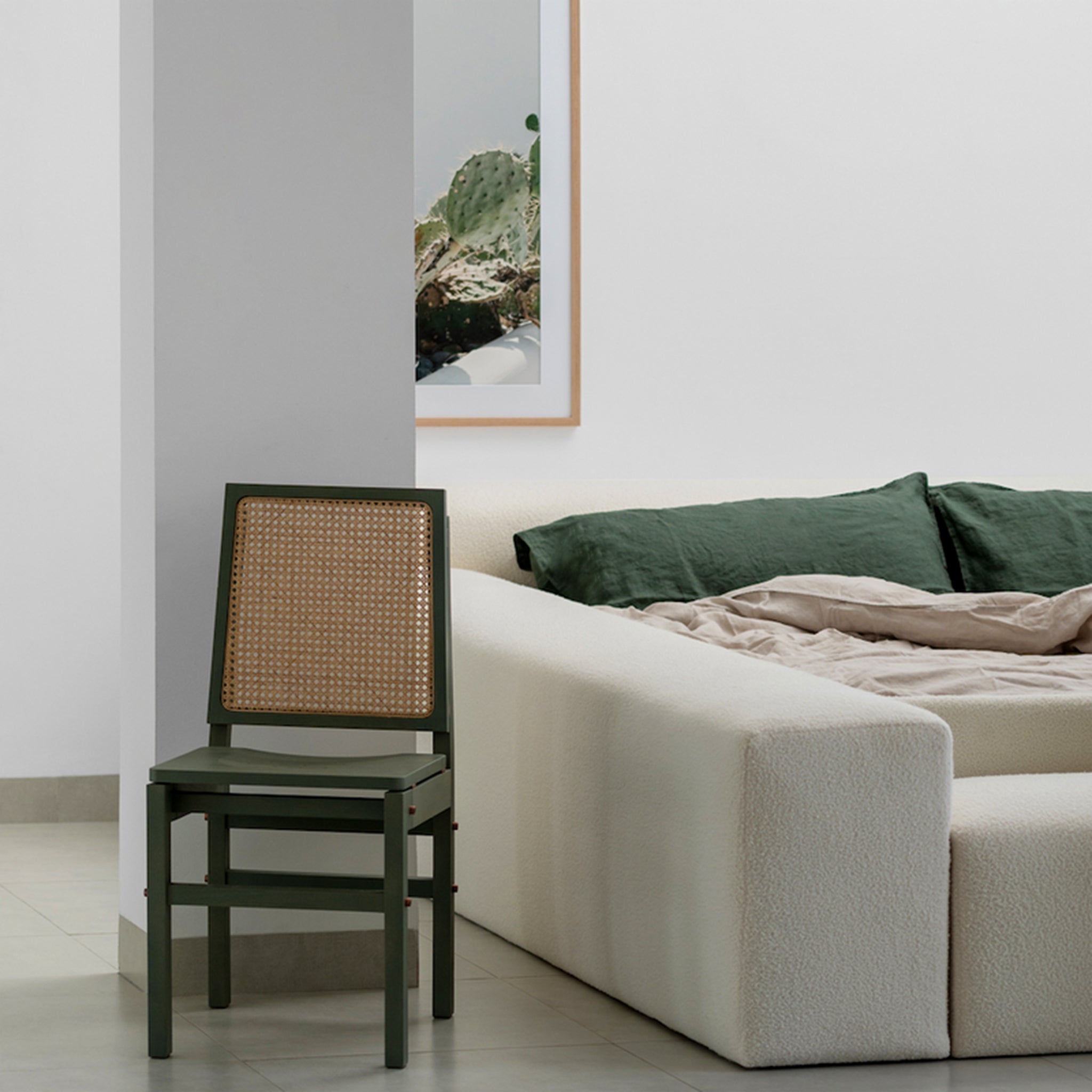 Plush gray king-size bed with biscuit-tufted upholstery and integrated benches on either side. The Heff Bed by Klettkic provides a space-saving solution for modern bedrooms, offering extra seating for reading, relaxing, or putting on shoes.