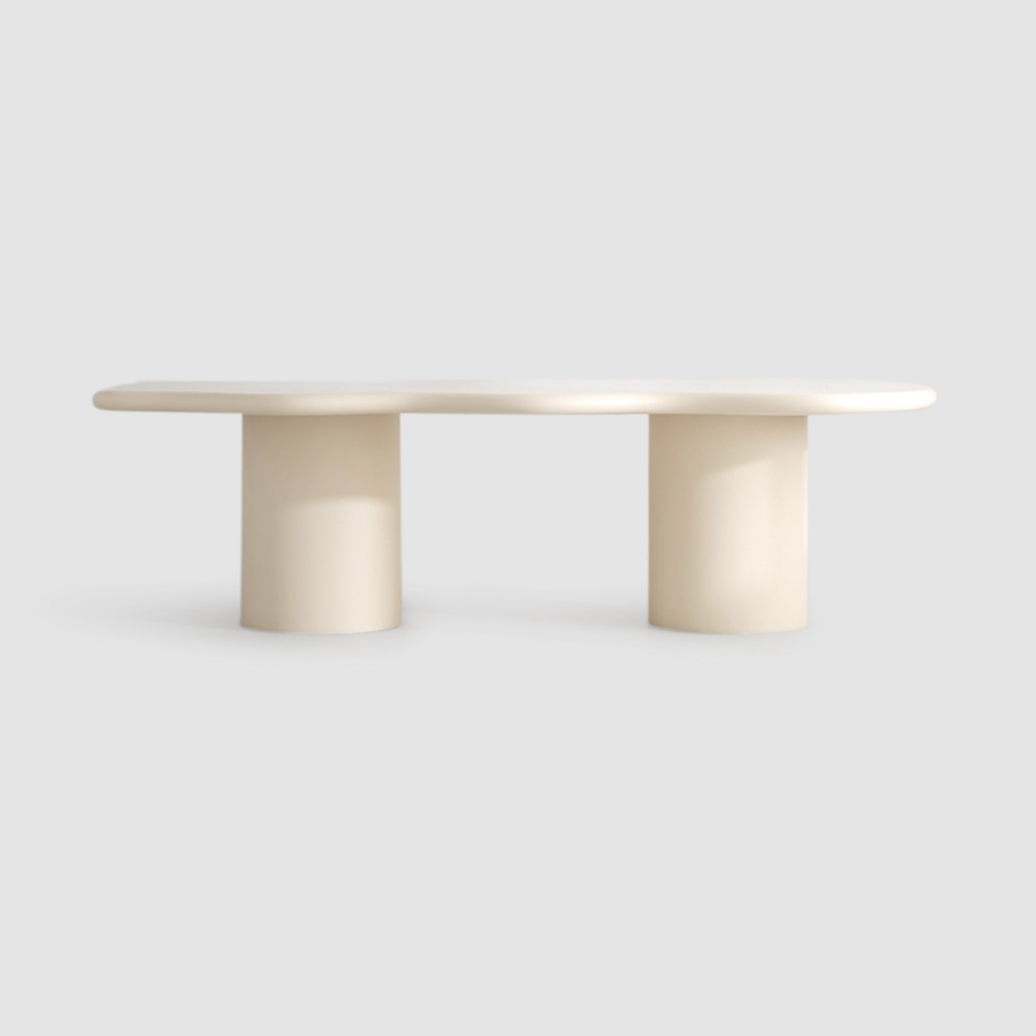 Beige dining table with a unique wavy design and sturdy construction