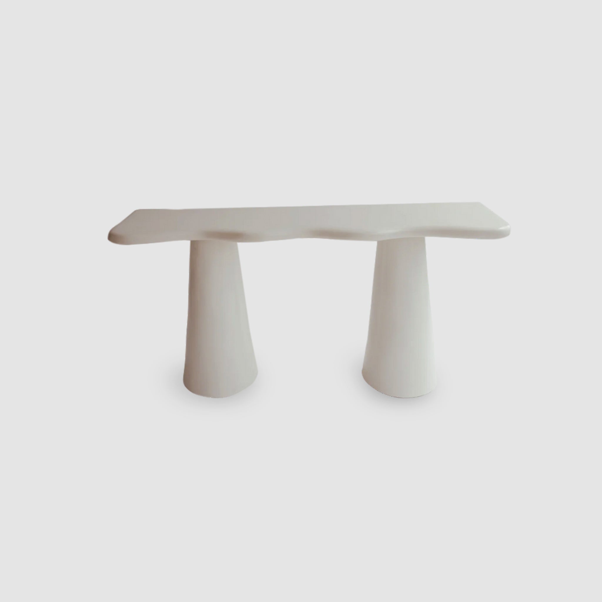 "The Alma Console with a curvy, statement-making design in white microplaster finish."