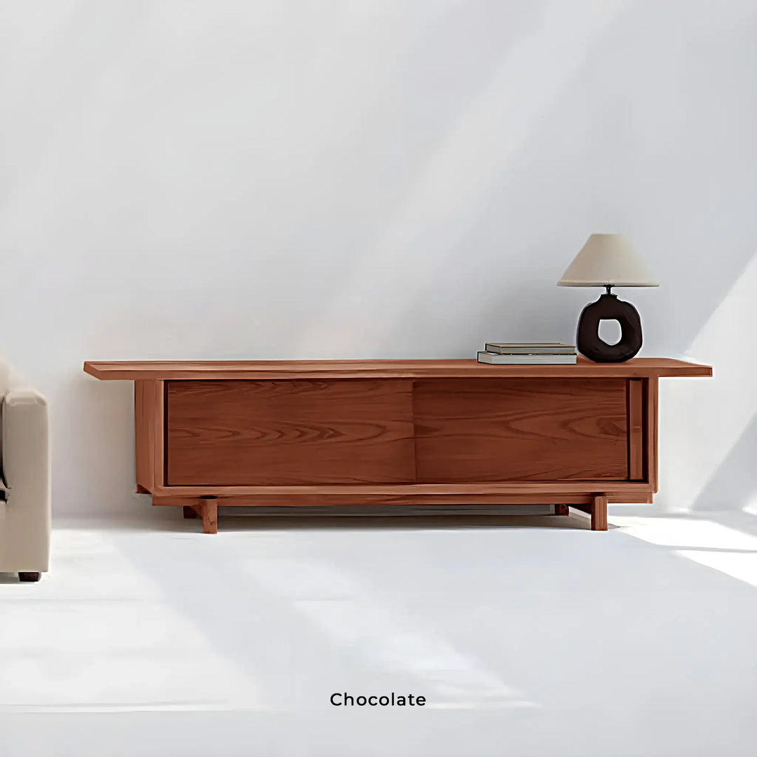 The Arbor wooden TV unit, styled in a cozy living room with a rich coffee color tone.