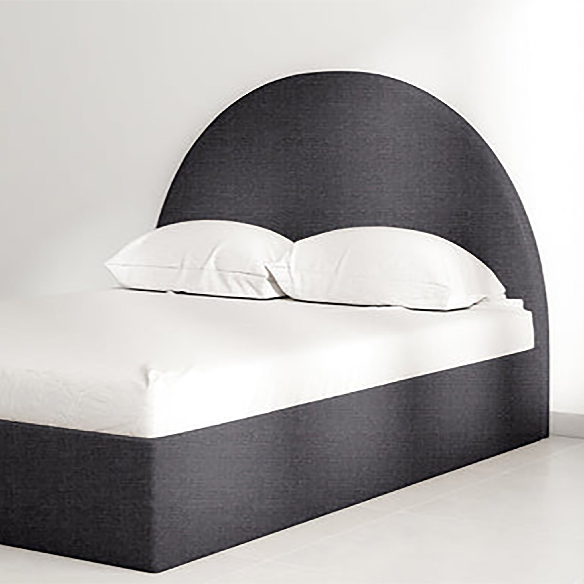 The Archie Bed featuring a luxurious curved headboard in high-quality dark upholstery. Perfect for modern living spaces with narrow and compact design, ideal for master bedrooms and guest rooms. Elegant and space-saving furniture for contemporary homes.