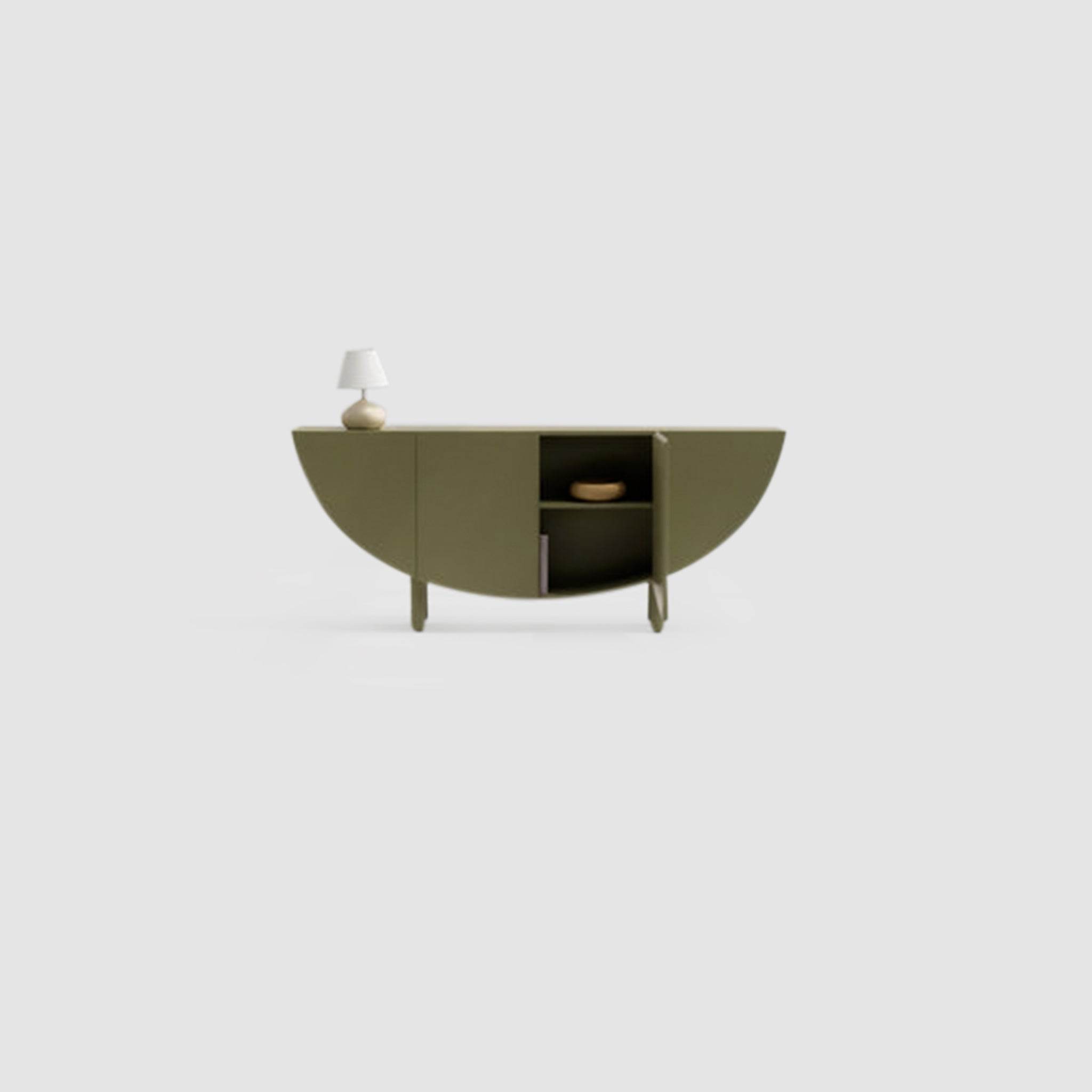 A minimalist olive green sideboard with a half-moon design, featuring an open compartment and a small white table lamp on top, set against a light gray background
