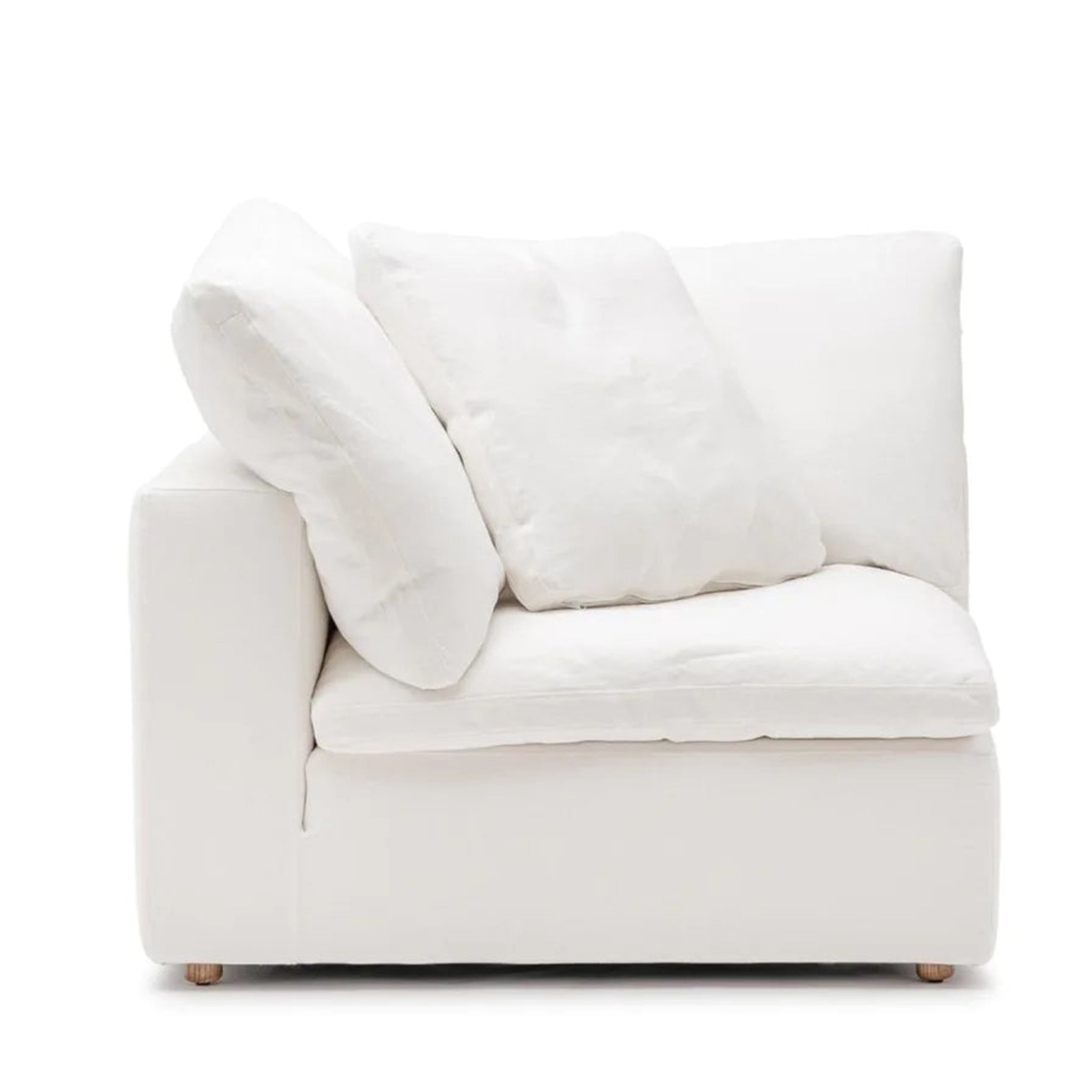 White curved Constance sofa with button-tufted back in a modern living room