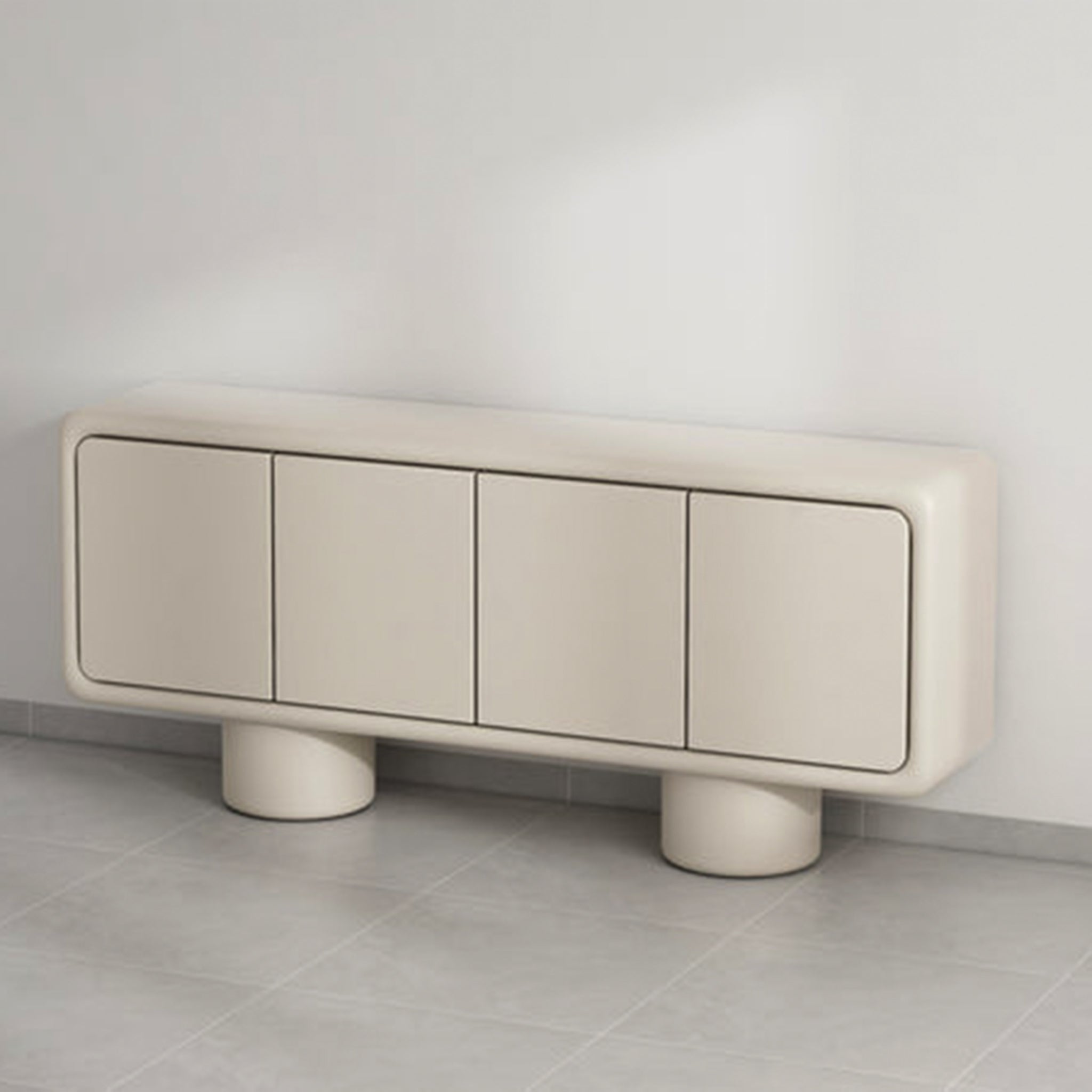 A stylish beige sideboard with a minimalist design, featuring four doors and supported by two cylindrical legs, placed against a wall in a modern interior.