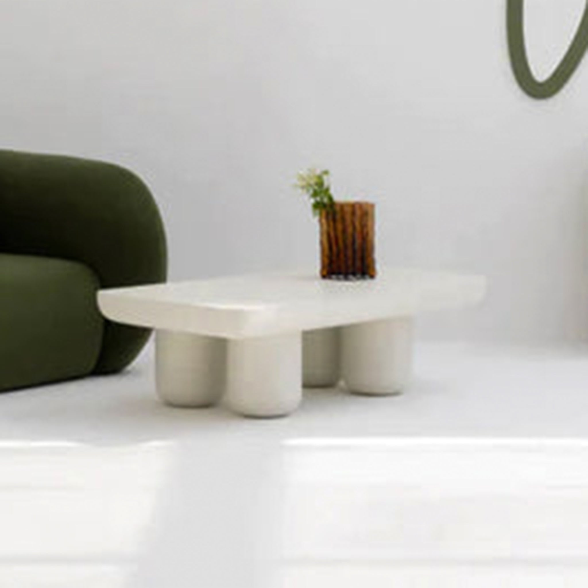 Contemporary white coffee table featuring a wooden vase centerpiece