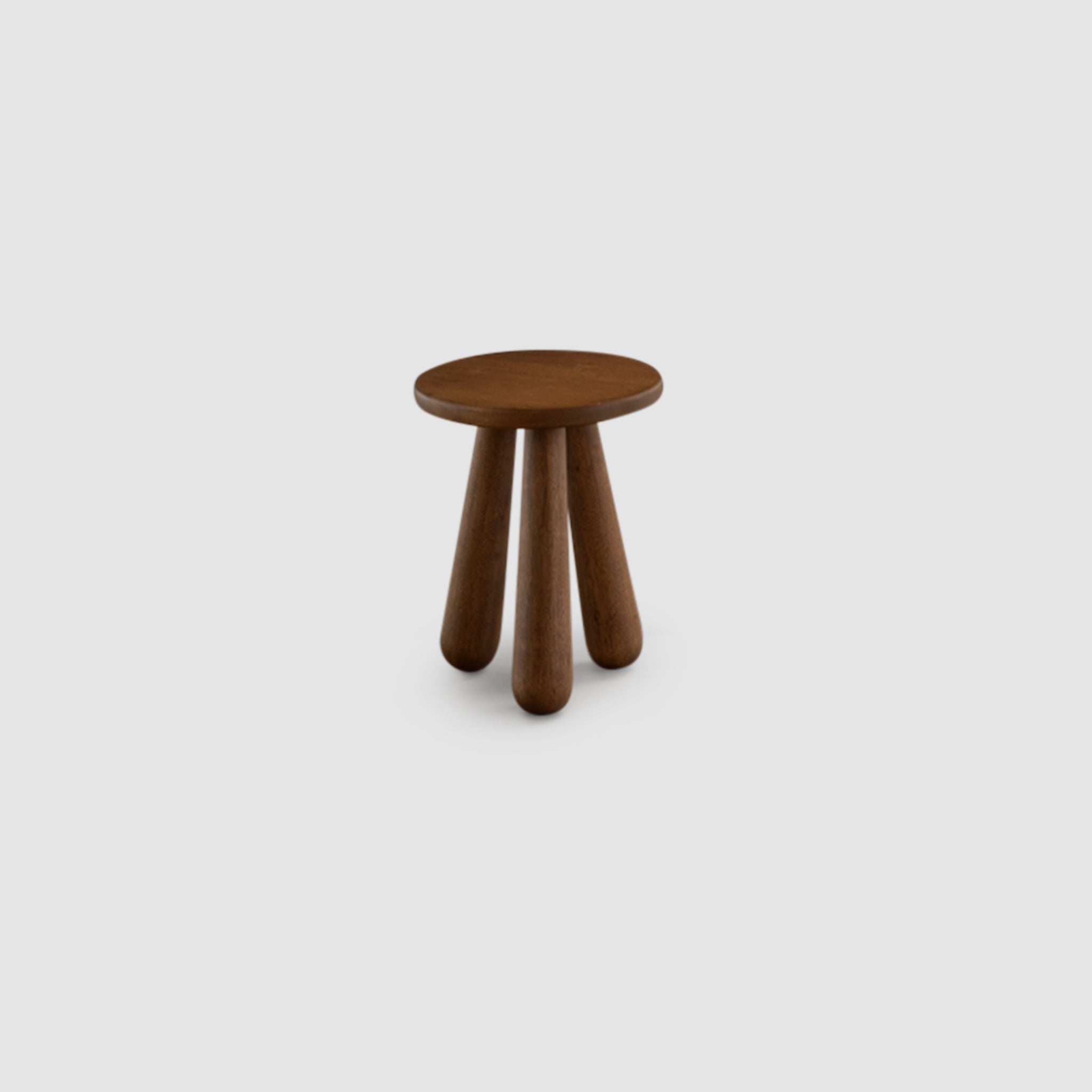 Brown wooden stool with chunky, rounded legs and a round seat on a white background