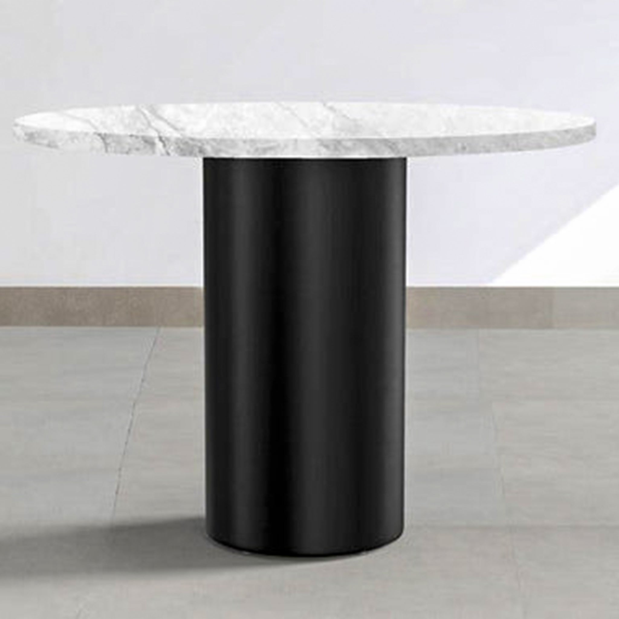 Glass and metal beside table offering a modern and sleek aesthetic.