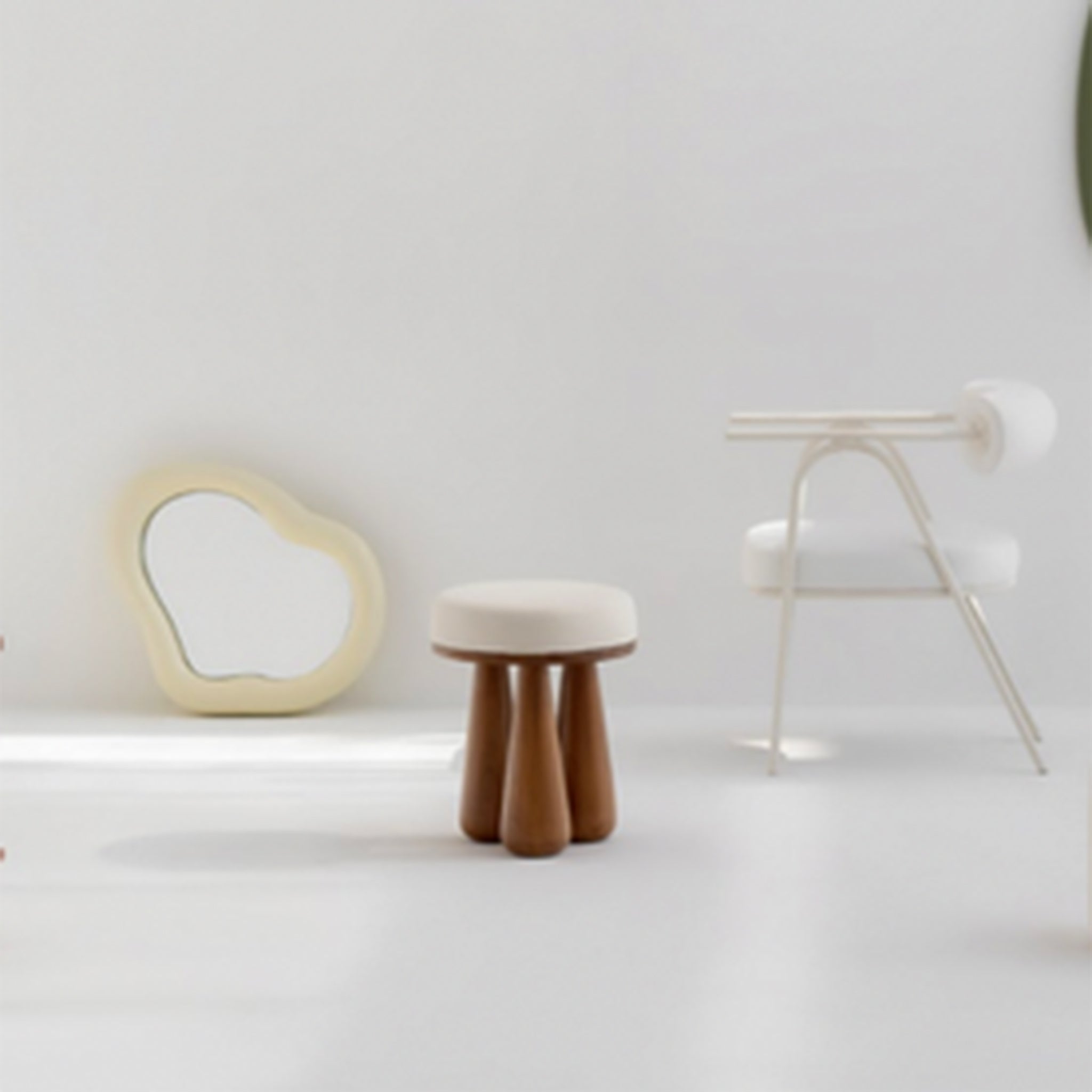 Modern interior with a wooden stool featuring chunky legs and a round upholstered white seat, a unique mirror, and a contemporary white chair
