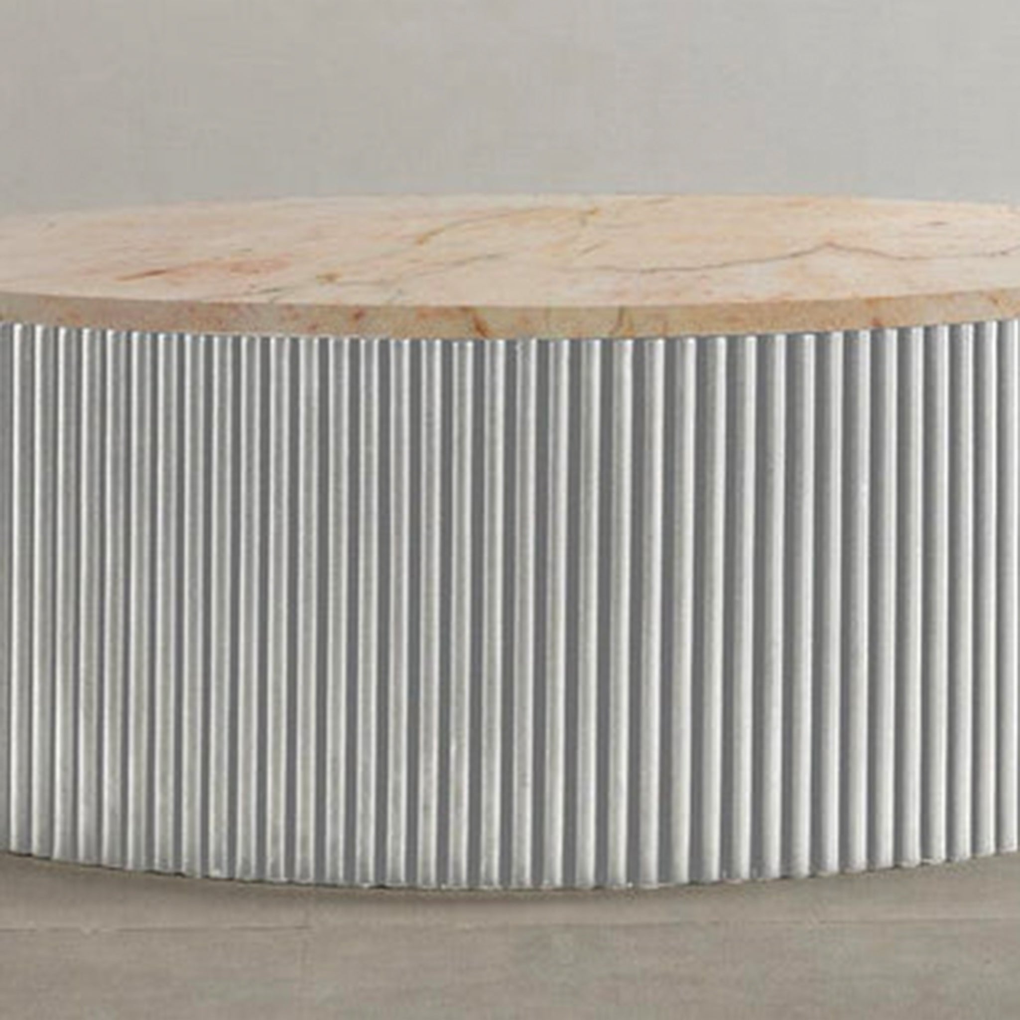 "Contemporary circular coffee table with vertical ribs"