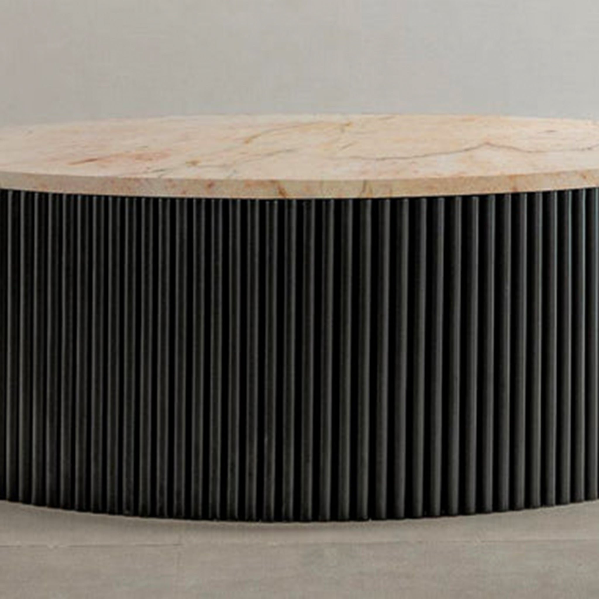 "Stylish coffee table with ribbed exterior and green stone surface"